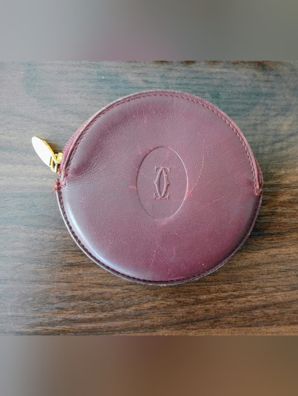 Authentic vintage Must de Cartier round zippered coin pouch in classic Bordeaux
